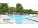 Community pool with chairs and umbrellas, offering a refreshing and relaxing amenity for residents at 4725 Parr Vista Ct, Raleigh, NC 27612