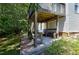 Patio under the deck featuring a bench and a gardening area at 4725 Parr Vista Ct, Raleigh, NC 27612