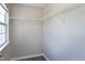 Spacious walk-in closet featuring a window and ample shelving at 4725 Parr Vista Ct, Raleigh, NC 27612