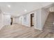 Spacious finished basement with recessed lighting and stairs leading to another level at 4901 Old Elizabeth Rd, Raleigh, NC 27616