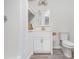 Bathroom with a white vanity, stylish mirror, and modern fixtures at 4901 Old Elizabeth Rd, Raleigh, NC 27616
