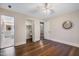 Bedroom with hardwood floors, ceiling fan, walk-in closet, and ensuite bathroom offers ample storage at 4901 Old Elizabeth Rd, Raleigh, NC 27616