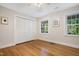 Bright bedroom features hardwood floors, natural light, and closet space at 4901 Old Elizabeth Rd, Raleigh, NC 27616