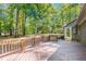 Wooden deck provides a serene outdoor space with scenic views of surrounding greenery at 4901 Old Elizabeth Rd, Raleigh, NC 27616