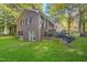 Brick home exterior with garage, well-maintained lawn and garden, and mature trees at 4901 Old Elizabeth Rd, Raleigh, NC 27616