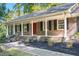 Charming brick ranch-style home with a cozy front porch and well-maintained landscaping at 4901 Old Elizabeth Rd, Raleigh, NC 27616