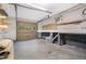 Garage area with workbench, storage, and a garage door at 4901 Old Elizabeth Rd, Raleigh, NC 27616