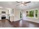 Bright, open eat-in kitchen features white cabinets, stainless appliances, and large windows overlooking the backyard at 4901 Old Elizabeth Rd, Raleigh, NC 27616