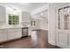 Well-lit kitchen boasting white cabinets, stainless steel appliances, and an open concept at 4901 Old Elizabeth Rd, Raleigh, NC 27616