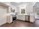 This kitchen features stainless steel appliances, lots of counter space, and recessed lighting at 4901 Old Elizabeth Rd, Raleigh, NC 27616