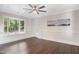 Bright living room with hardwood floors, bay window, and lots of natural light at 4901 Old Elizabeth Rd, Raleigh, NC 27616