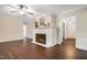 Bright living room featuring fireplace, hardwood floors, and ample natural light, perfect for entertaining at 4901 Old Elizabeth Rd, Raleigh, NC 27616