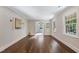 Spacious living room featuring hardwood flooring, natural light, and neutral paint at 4901 Old Elizabeth Rd, Raleigh, NC 27616