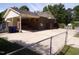 Spacious backyard with a fenced in gate and driveway entrance, and a shed at 4908 Mandel Rd, Durham, NC 27712
