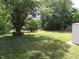 Enjoy the expansive backyard, perfect for outdoor activities and relaxation under the shade of mature trees at 4908 Mandel Rd, Durham, NC 27712