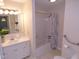Bathroom with vanity sink, and a shower and tub combination, with neutral color schemes at 4908 Mandel Rd, Durham, NC 27712
