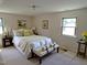 Serene bedroom with neutral tones and ample natural light at 4908 Mandel Rd, Durham, NC 27712