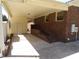 Covered carport area constructed with brick and siding, providing protection for vehicles and convenient access to the home at 4908 Mandel Rd, Durham, NC 27712