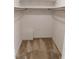 Empty walk-in closet with carpeted flooring at 4908 Mandel Rd, Durham, NC 27712
