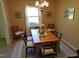 Inviting dining room with a large table and vintage chandelier at 4908 Mandel Rd, Durham, NC 27712
