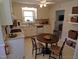 Eat-in kitchen featuring bright cabinets and a window over the sink at 4908 Mandel Rd, Durham, NC 27712