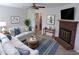 Bright living room with a fireplace, ceiling fan and stylish decor at 4908 Mandel Rd, Durham, NC 27712