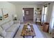 Comfortable living room with ample natural light and modern furnishings at 4908 Mandel Rd, Durham, NC 27712