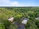 Aerial view of the condo complex surrounded by lush greenery and trees at 500 Umstead Dr # 103C, Chapel Hill, NC 27516