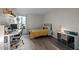Bright bedroom with a large window, desk area, and stylish furnishings offers comfort and functionality at 500 Umstead Dr # 103C, Chapel Hill, NC 27516