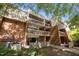 Brick apartment building featuring multiple balconies and well-maintained landscaping at 500 Umstead Dr # 103C, Chapel Hill, NC 27516