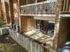 Lower level patio with fencing and sliding glass doors offering direct access to interior living spaces at 500 Umstead Dr # 103C, Chapel Hill, NC 27516