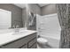 Bathroom with single vanity, tile floors, and a shower-tub combination with white finishes at 524 Providence Springs Ln, Fuquay Varina, NC 27526