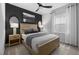 Well lit main bedroom features a neutral palette, ceiling fan, and stylish design at 524 Providence Springs Ln, Fuquay Varina, NC 27526