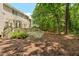 Relaxing backyard features a deck, shed, firepit, and a wooded area for ultimate tranquility at 6 Gasper Ct, Durham, NC 27713