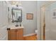 Bathroom featuring a wood vanity, decorative mirror, and glass enclosed shower at 6 Gasper Ct, Durham, NC 27713