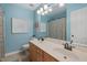 Bathroom with tile floor, light blue walls, and double sinks at 6 Gasper Ct, Durham, NC 27713