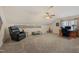 Spacious bonus room features a vaulted ceiling, neutral paint, ceiling fan, and comfortable seating at 6 Gasper Ct, Durham, NC 27713