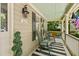 Cozy front porch with rocking chairs, a swing, and a striped rug, perfect for relaxing outdoors at 6 Gasper Ct, Durham, NC 27713
