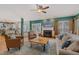 Bright and inviting living room featuring a fireplace, and an open layout to the kitchen and dining areas at 6 Gasper Ct, Durham, NC 27713