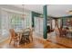 Bright dining area flowing into a comfortable living room, with hardwood floors and lots of natural light at 6 Gasper Ct, Durham, NC 27713
