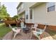 Backyard patio area with comfortable seating and a firepit at 6002 Whisperwood Dr, Durham, NC 27713