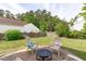 Patio with four chairs and a fire pit at 6002 Whisperwood Dr, Durham, NC 27713