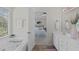 Bathroom that opens to the Primary bedroom with a vanity and soaking tub at 6002 Whisperwood Dr, Durham, NC 27713
