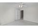 This bedroom has neutral walls, white trim, and a ceiling fan at 6002 Whisperwood Dr, Durham, NC 27713