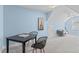 Large bonus room featuring blue walls and vaulted ceiling, complete with chess table and sofa at 6002 Whisperwood Dr, Durham, NC 27713