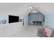 This bonus room features built-in storage, games, a television, and seating for relaxing at 6002 Whisperwood Dr, Durham, NC 27713