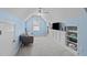 Blue bonus room with built-ins offers a relaxing space for various activities and entertainment at 6002 Whisperwood Dr, Durham, NC 27713