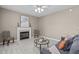 Comfortable living room with a fireplace, neutral tones, and a ceiling fan for added comfort at 6002 Whisperwood Dr, Durham, NC 27713