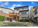 Expansive backyard featuring a wooden deck and lush green lawn at 644 Angelica Cir, Cary, NC 27518