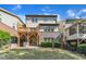 Exterior view of backyard with deck, lawn, and brick and gray siding at 644 Angelica Cir, Cary, NC 27518